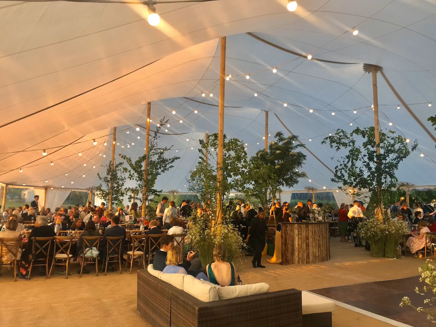 Outdoor wedding reception in a marquee.