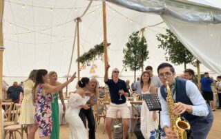 A group of people in the marquee.